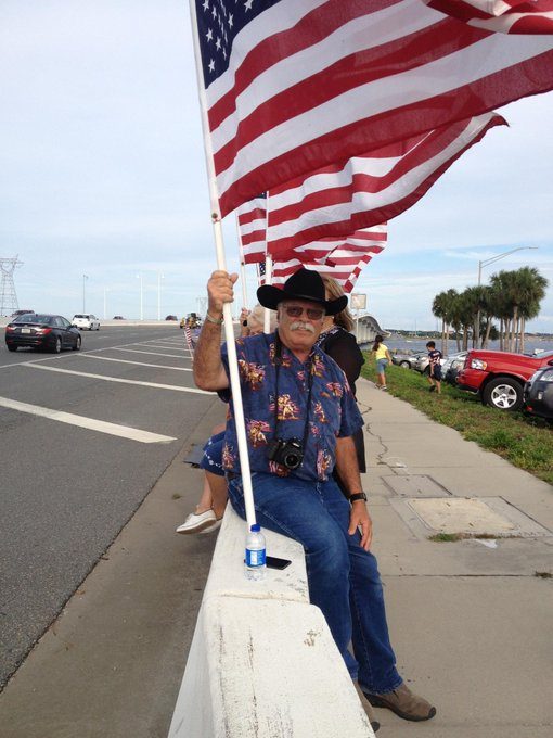 Jim Zumbo holding an American Flag